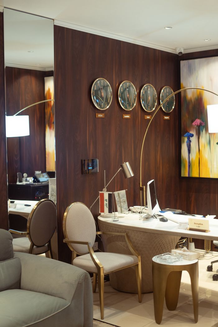 services-01 Elegant office room with modern furniture and decor clocks indicating global cities.
